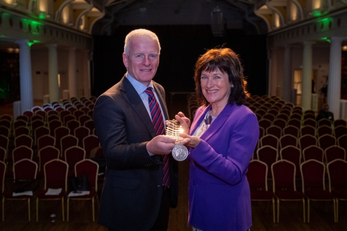 Breda Crehan Roche receiving the chain from immediate HMI Past President, Tony Canavan.