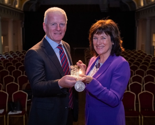 Breda Crehan Roche receiving the chain from immediate HMI Past President, Tony Canavan.