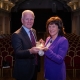 Breda Crehan Roche receiving the chain from immediate HMI Past President, Tony Canavan.